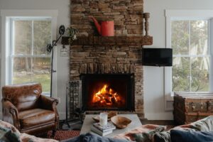 A living room with a portable heater set safely away from furniture and children playing nearby.